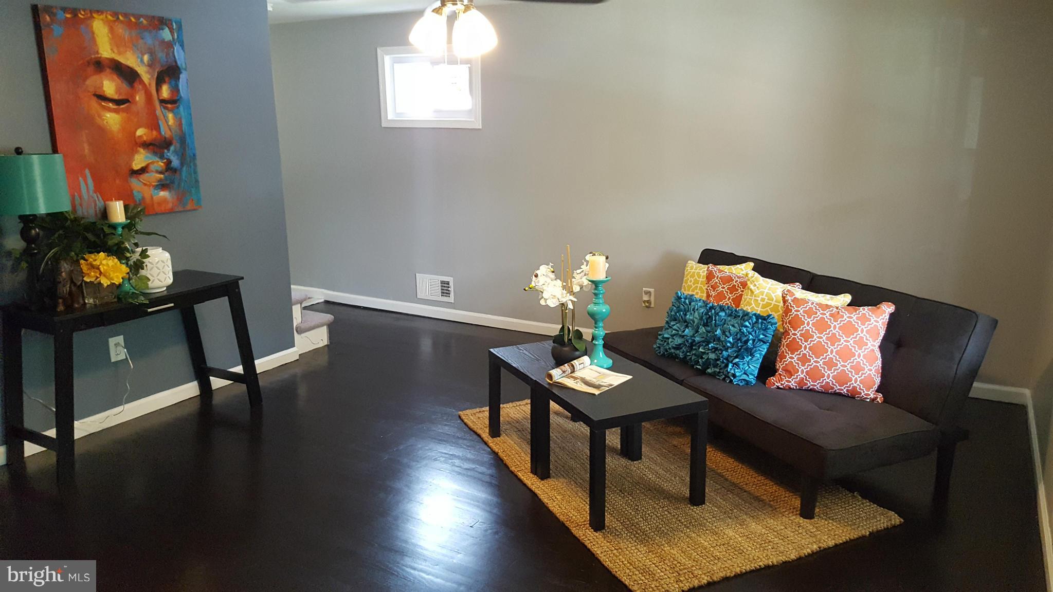 1034 Middleborough Road Baltimore, MD 21221 - Photo 3 of 29 a living room with furniture and a wooden floor