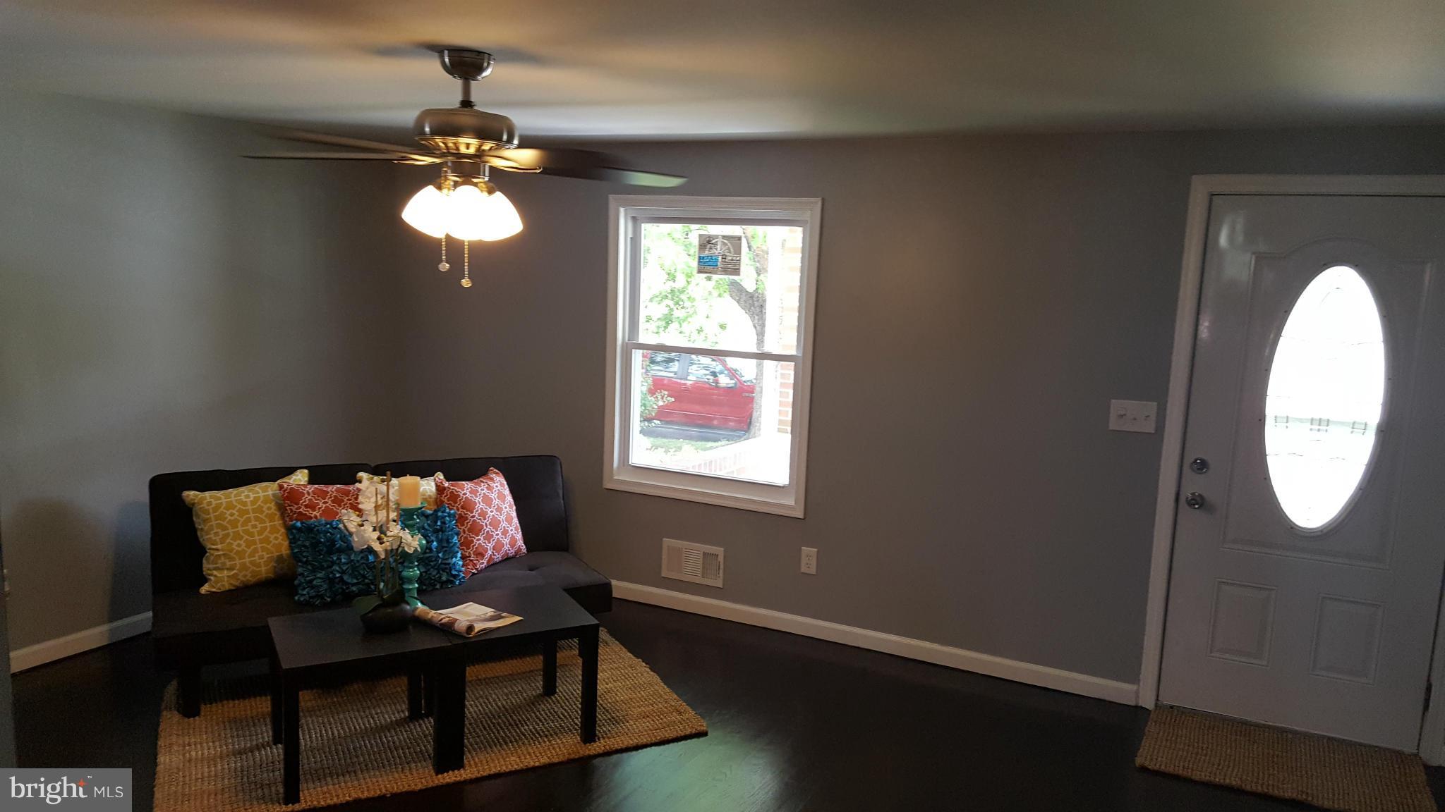 1034 Middleborough Road Baltimore, MD 21221 - Photo 5 of 29 a view of a livingroom with furniture and wooden floor