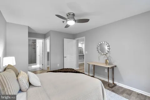 a bedroom with a bed and a table