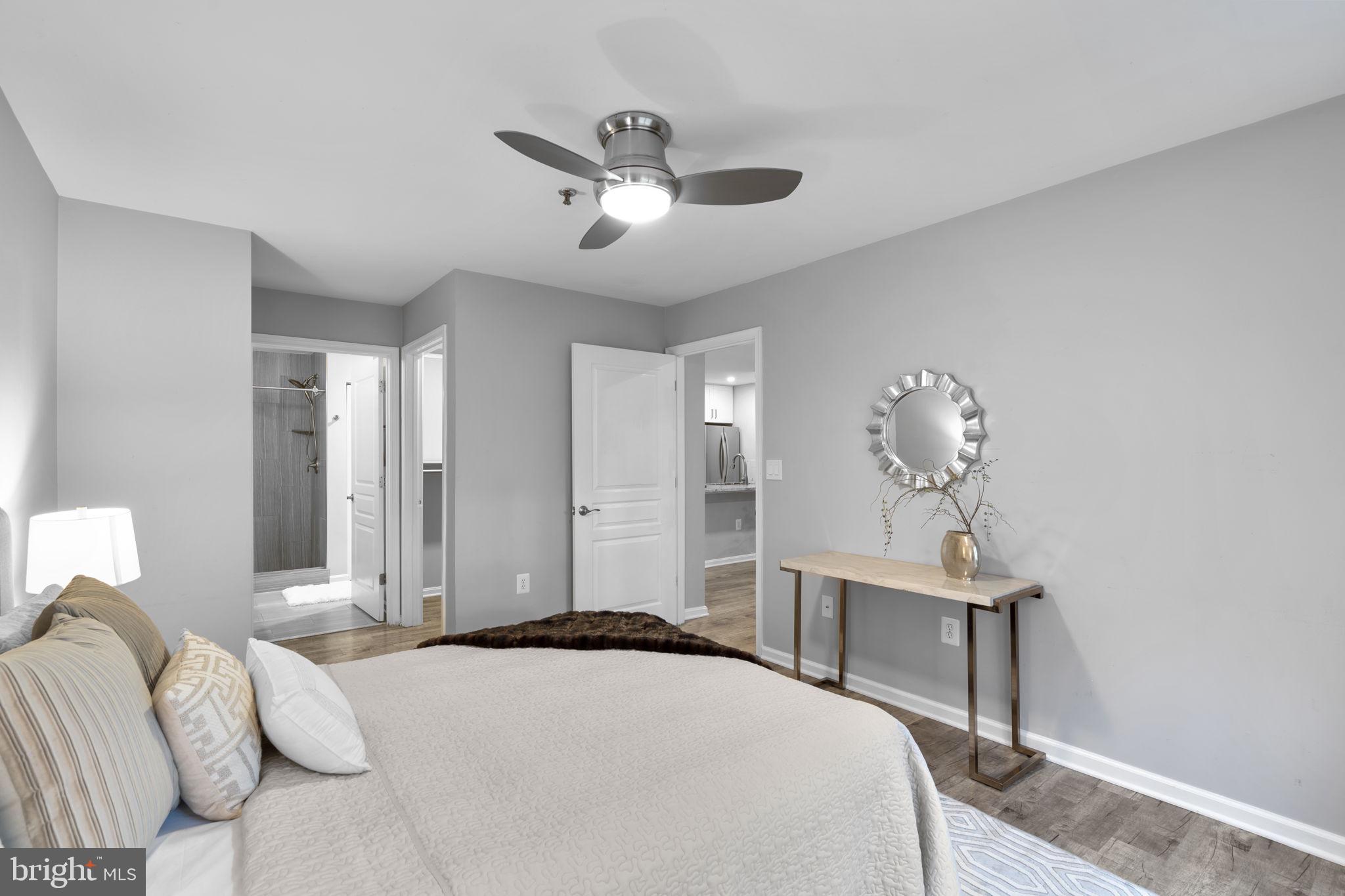 5575 Seminary Road, Unit 102 Falls Church, VA 22041 - Photo 26 of 31 a bedroom with a bed and a table