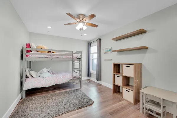 a bedroom with a bed and hallway