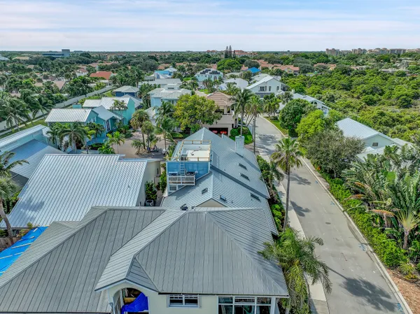 an aerial view of a house with a garden