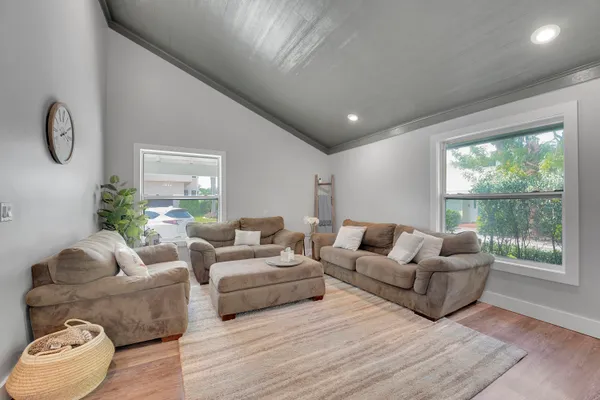 a living room with furniture and a large window