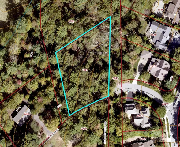 a view of a patio with table and chairs under an umbrella