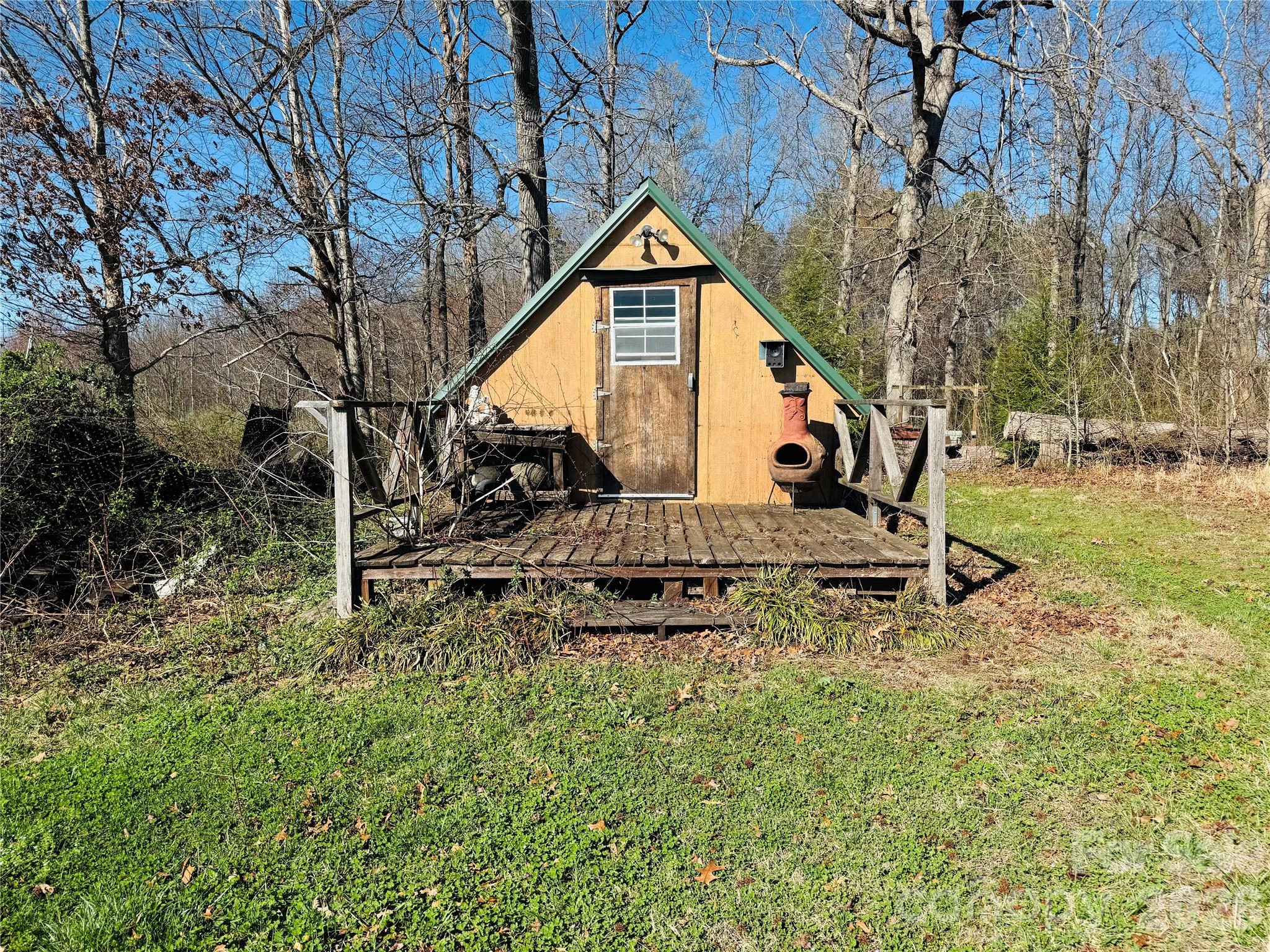 824 Baxter Road Cherryville, NC 28021 - Photo 5 of 13 a view of a house with a yard and sitting area