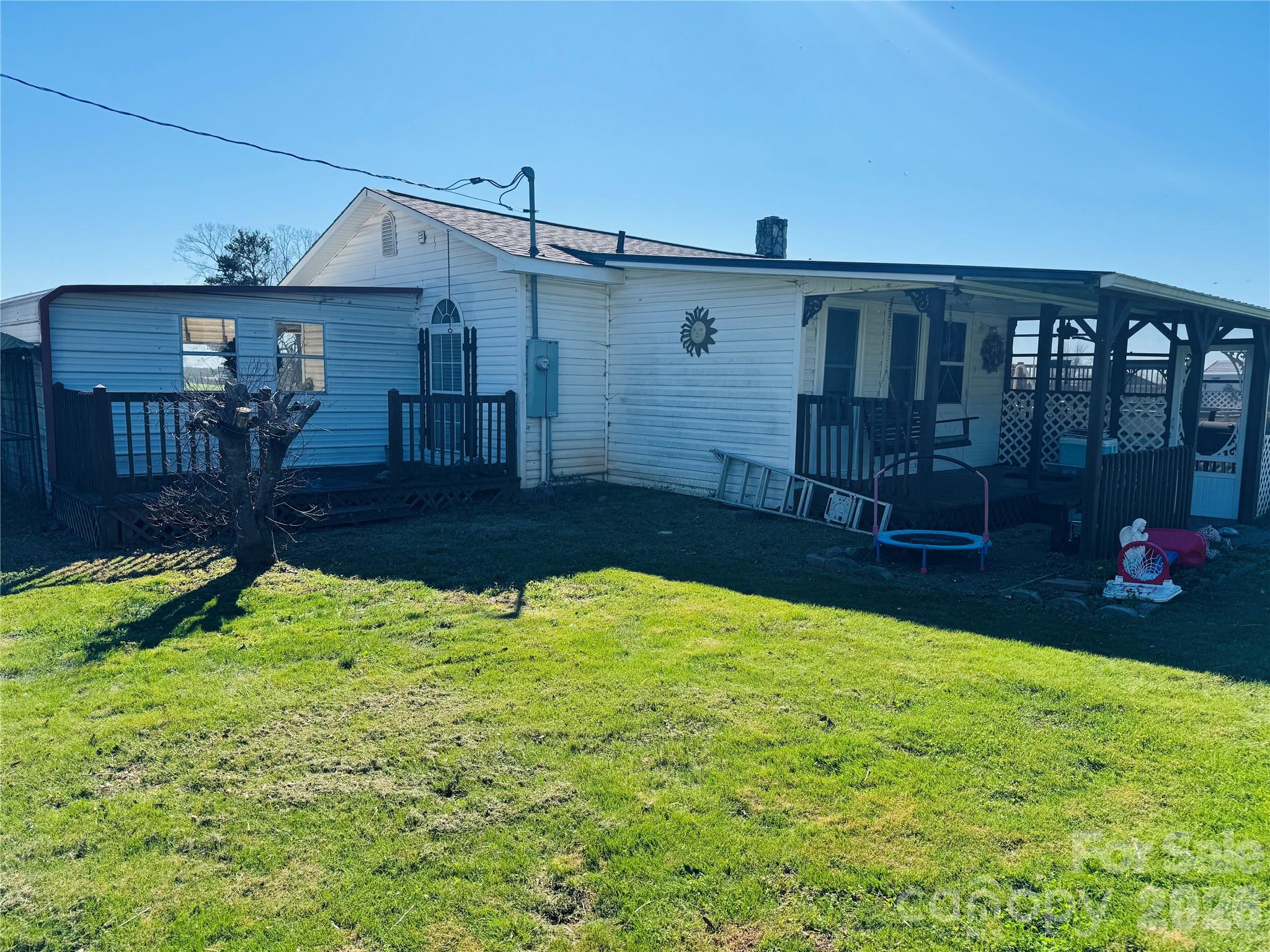 824 Baxter Road Cherryville, NC 28021 - Photo 6 of 13 a backyard of a house with yard and outdoor seating