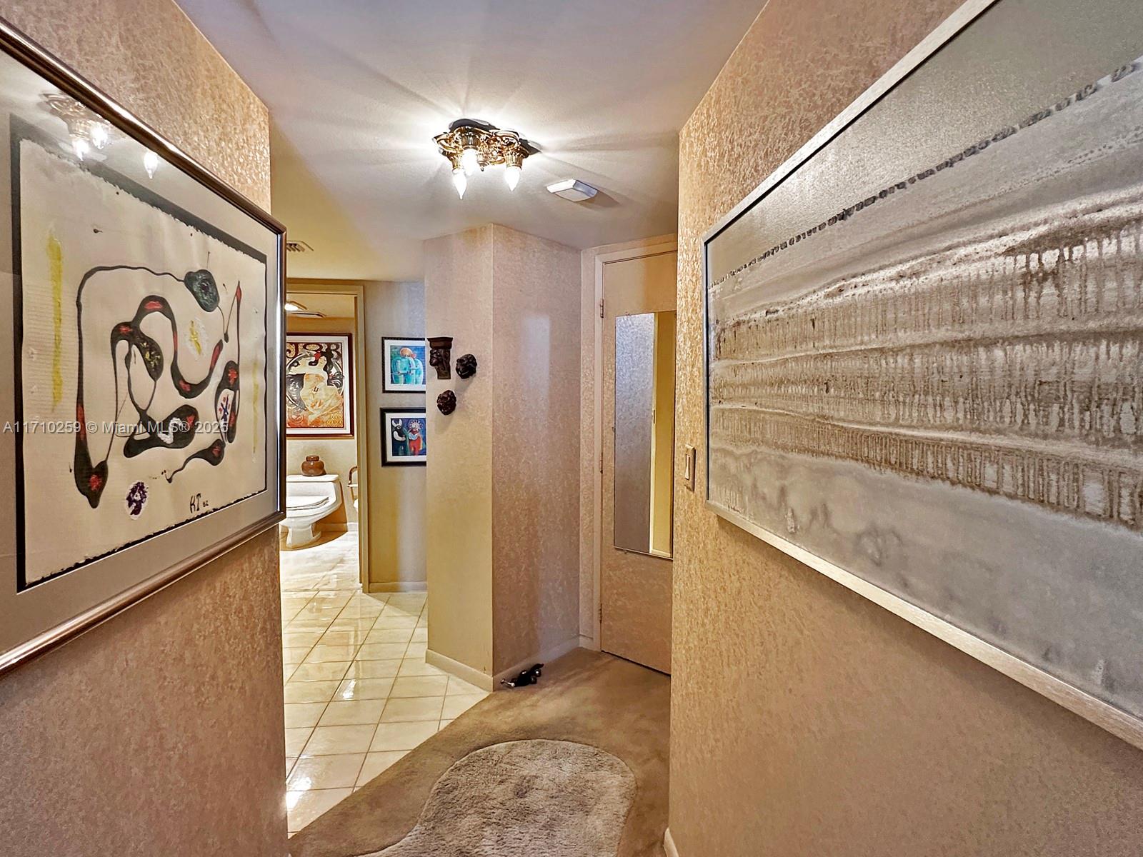520 Brickell Key Drive, Unit A1802 Miami, FL 33131 - Photo 16 of 35 a view of a hallway with a door