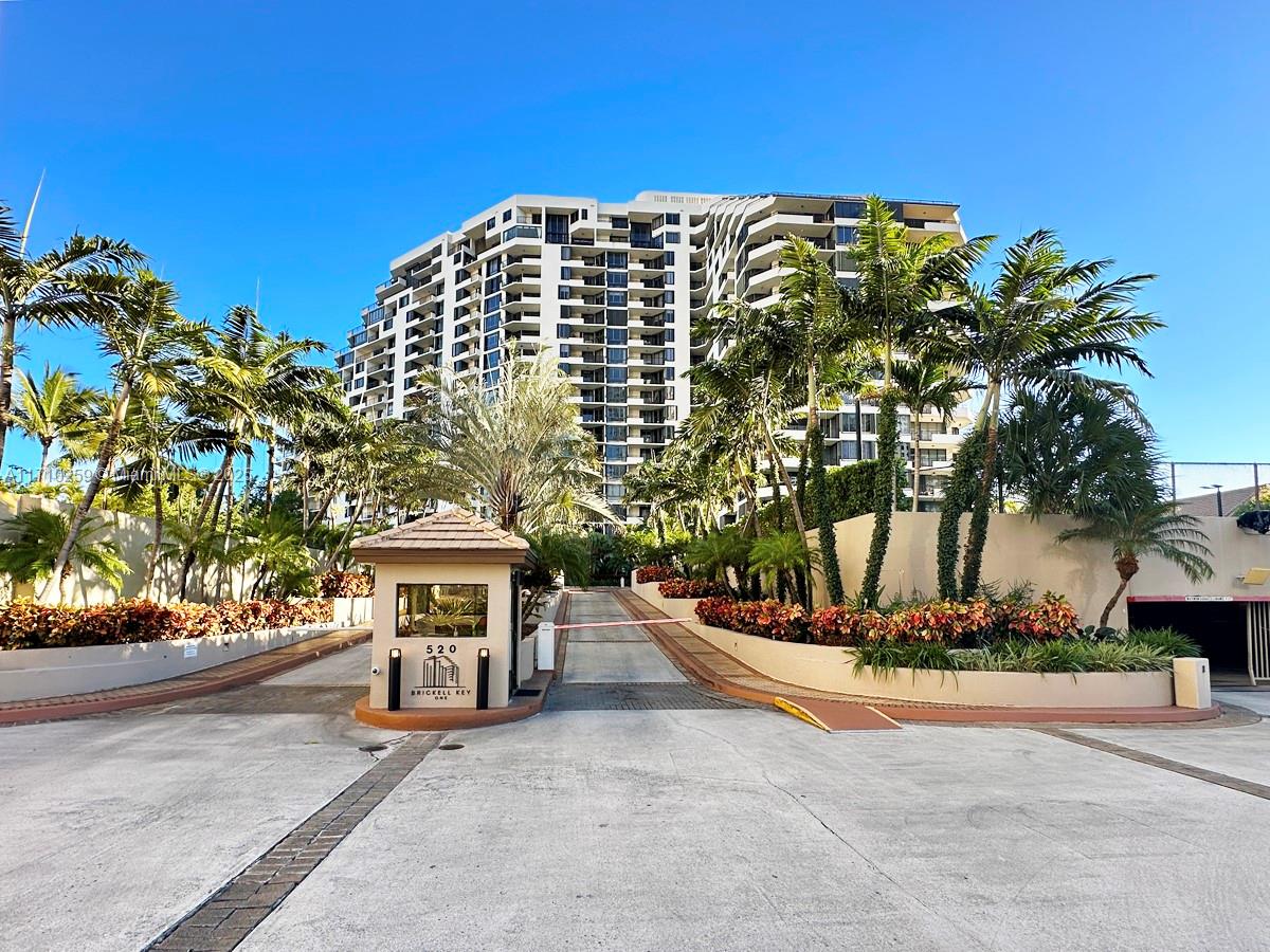 520 Brickell Key Drive, Unit A1802 Miami, FL 33131 - Photo 22 of 35 a view of tall buildings and cars parked on road
