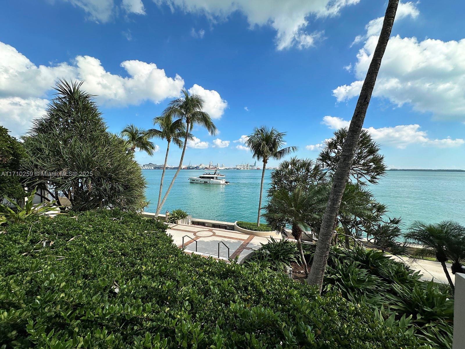 520 Brickell Key Drive, Unit A1802 Miami, FL 33131 - Photo 34 of 35 a backyard of a house with lots of green space