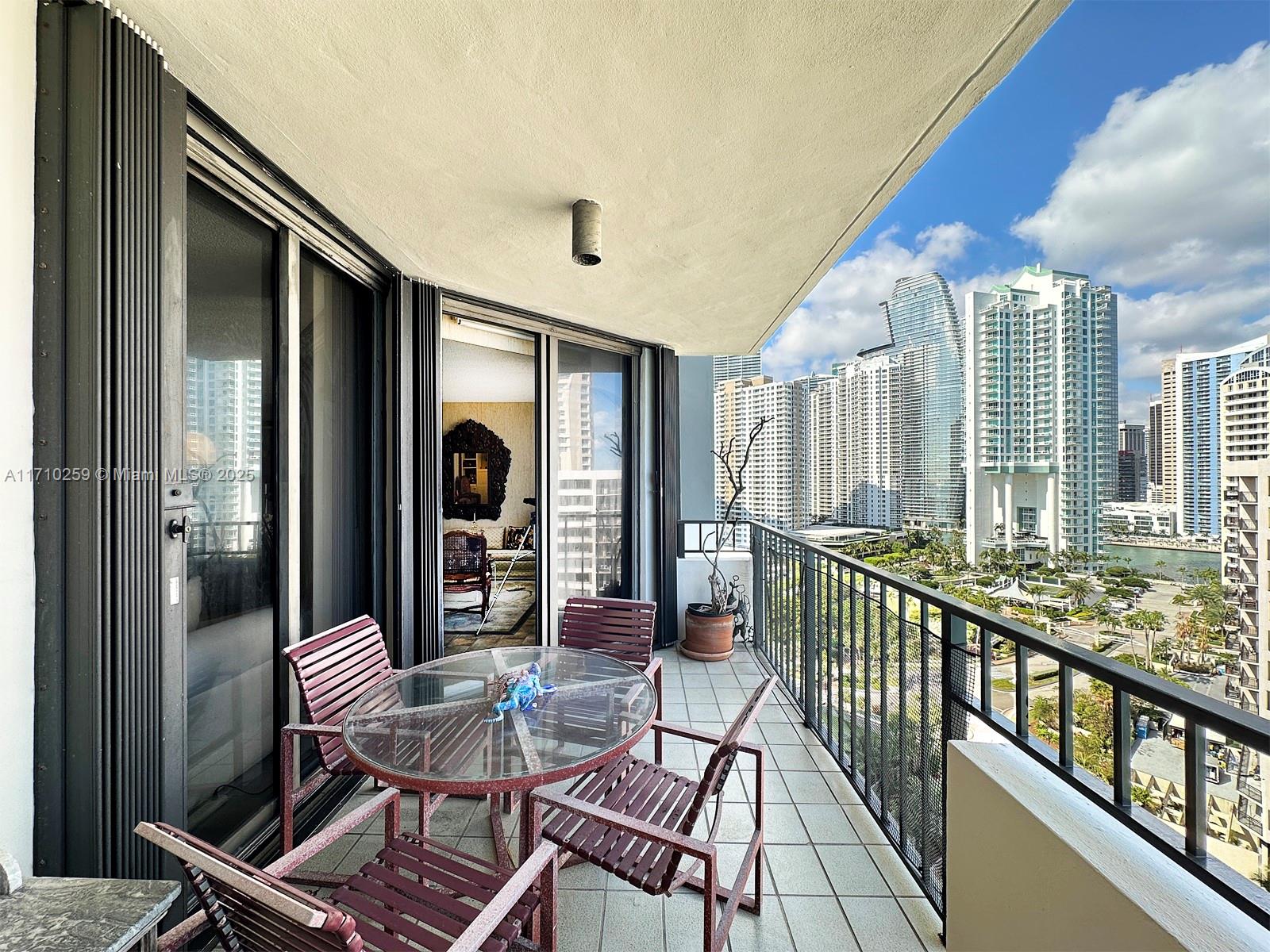 520 Brickell Key Drive, Unit A1802 Miami, FL 33131 - Photo 4 of 35 a view of a balcony with chairs