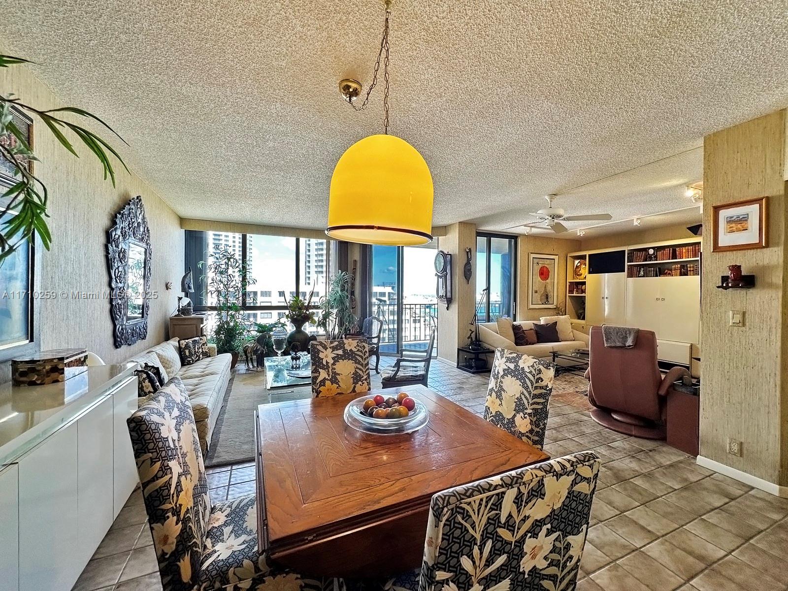 520 Brickell Key Drive, Unit A1802 Miami, FL 33131 - Photo 6 of 35 a view of a dining room with furniture