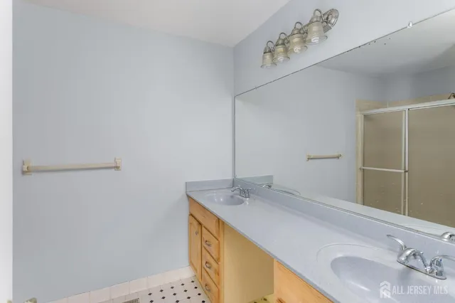 a bathroom with a sink and a mirror