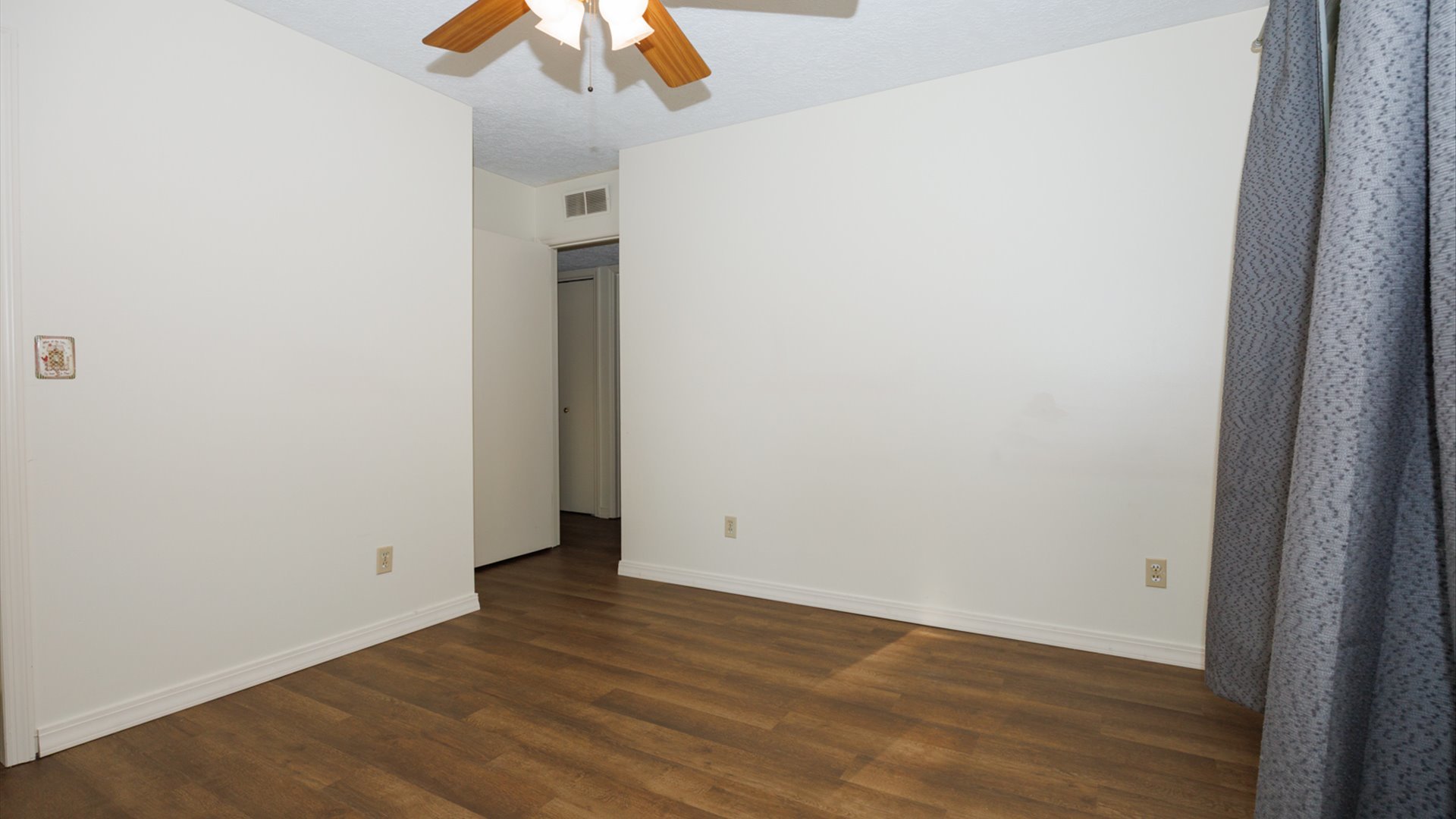800 West Hamilton Street Atlanta, IL 61723 - Photo 27 of 44 a view of an empty room with wooden floor