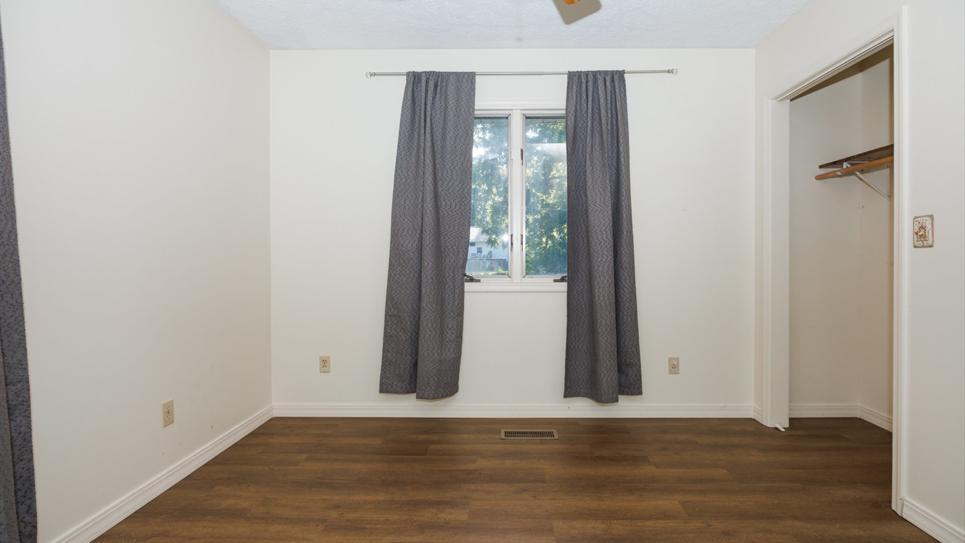 800 West Hamilton Street Atlanta, IL 61723 - Photo 28 of 44 a view of a room with wooden floor and a window