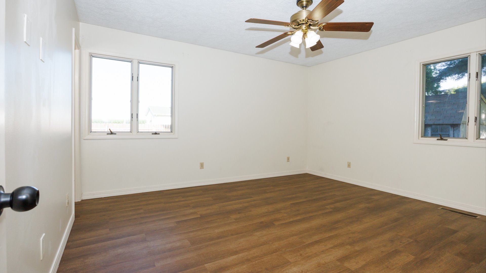 800 West Hamilton Street Atlanta, IL 61723 - Photo 29 of 44 an empty room with a window and a fan