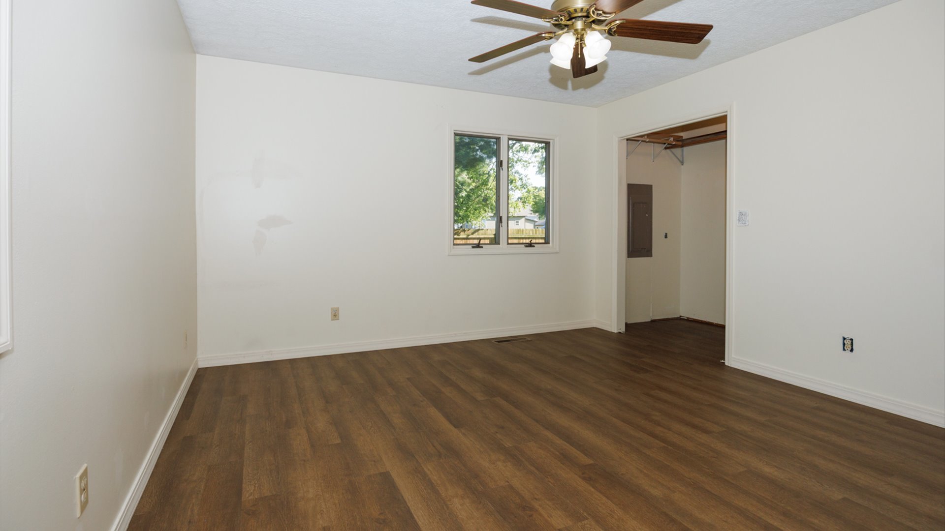 800 West Hamilton Street Atlanta, IL 61723 - Photo 31 of 44 wooden floor in an empty room with a window