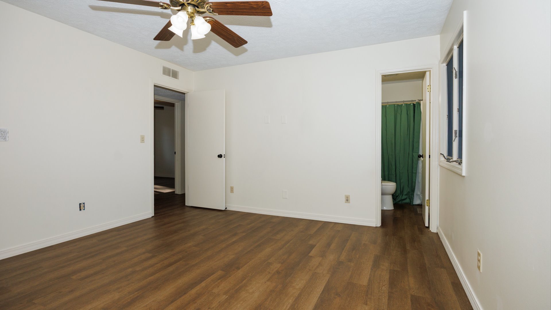800 West Hamilton Street Atlanta, IL 61723 - Photo 32 of 44 wooden floor in an empty room with a window