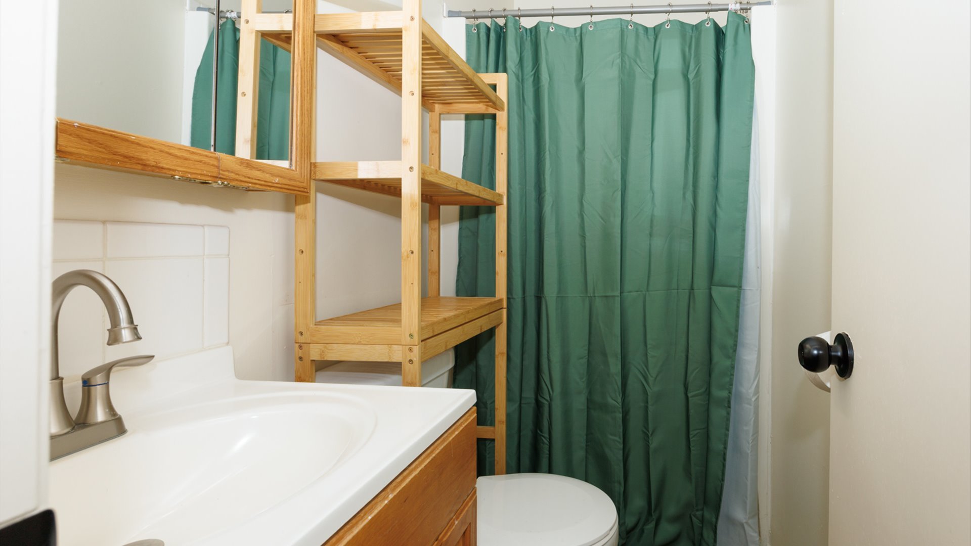 800 West Hamilton Street Atlanta, IL 61723 - Photo 35 of 44 a bathroom with a sink a toilet and shower