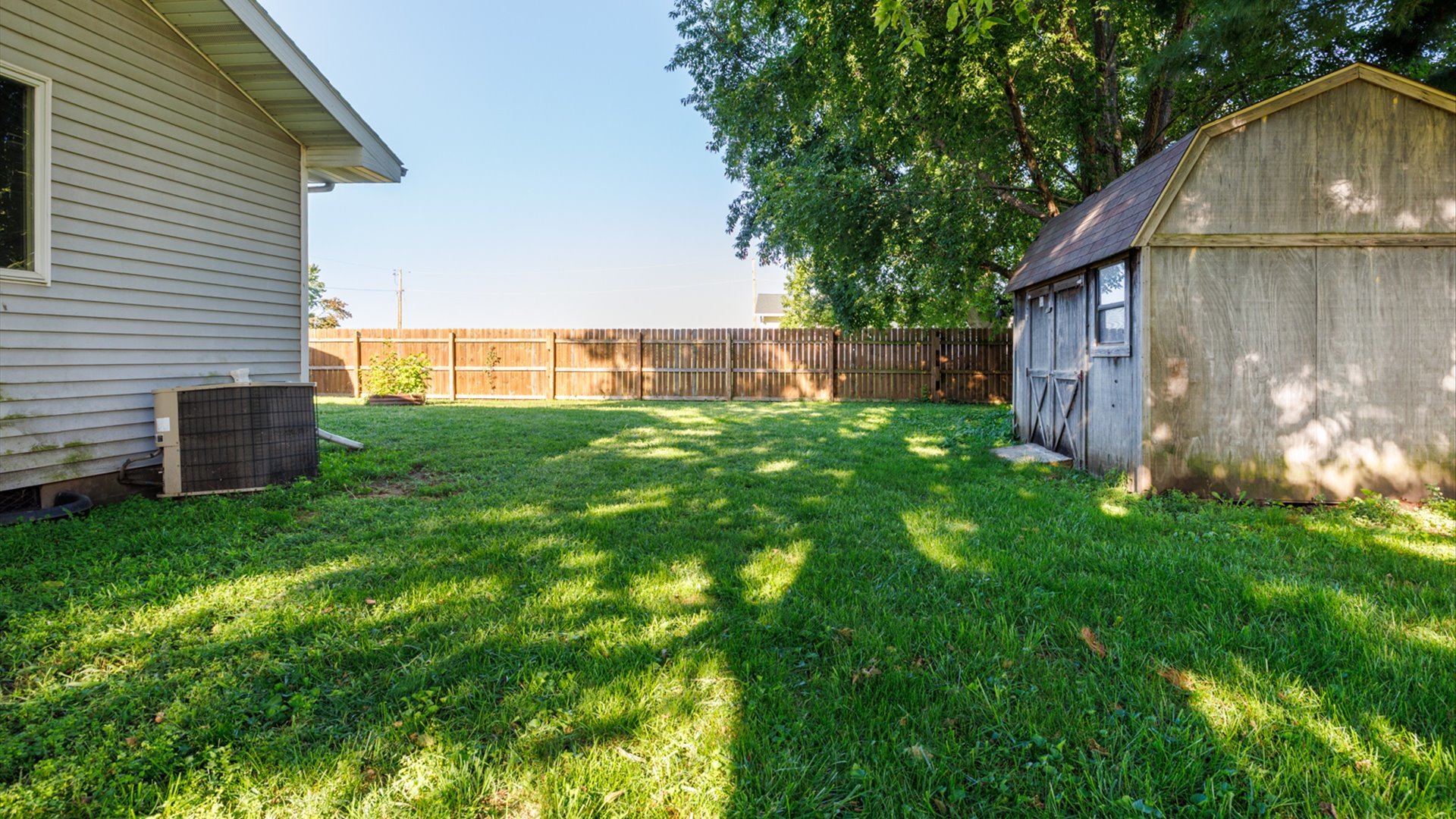800 West Hamilton Street Atlanta, IL 61723 - Photo 41 of 44 a backyard of a house with lots of green space