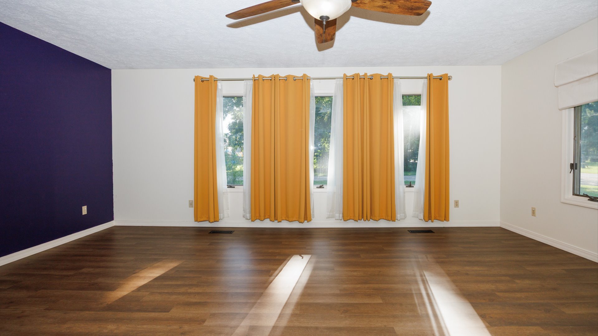 800 West Hamilton Street Atlanta, IL 61723 - Photo 9 of 44 a view of a room with wooden floor and windows