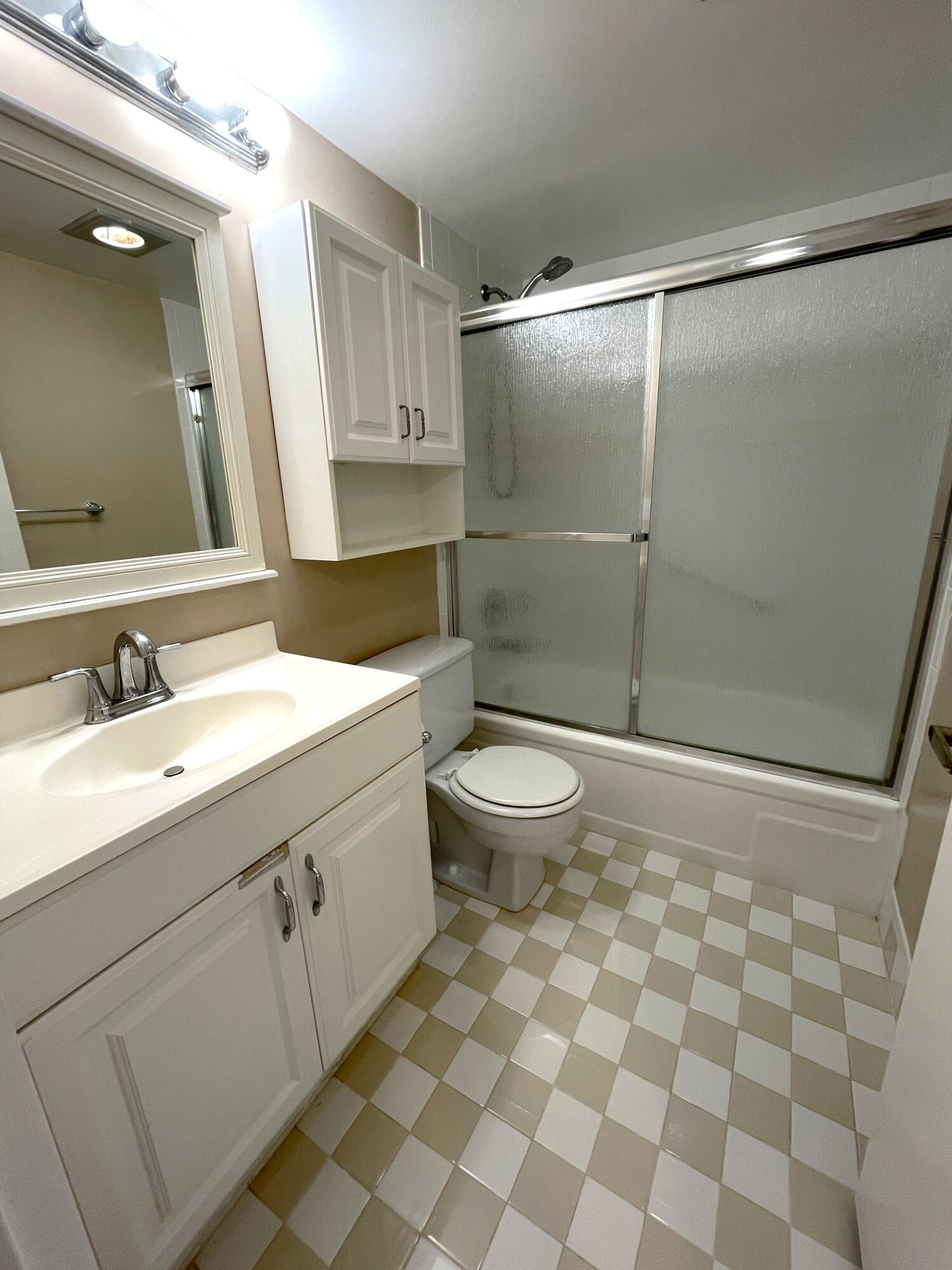 1020 Exeter, Unit 1020 Boca Raton, FL 33434 - Photo 14 of 29 a bathroom with a sink and a mirror