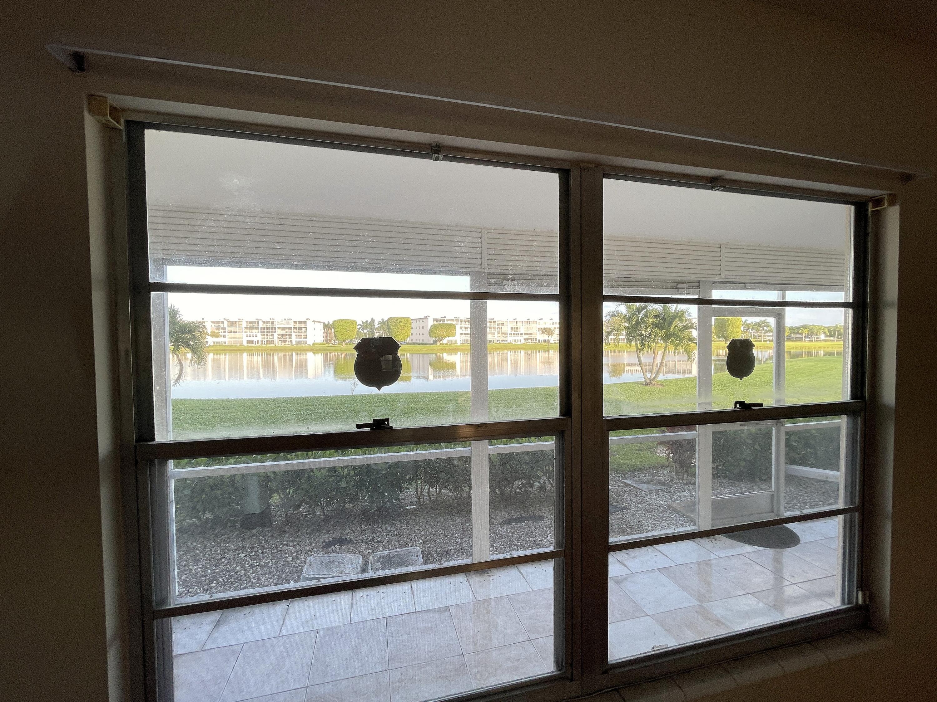 1020 Exeter, Unit 1020 Boca Raton, FL 33434 - Photo 16 of 29 a view of a glass door