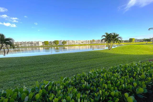 a view of a lake with houses in the back