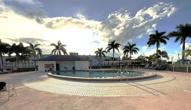 a view of a swimming pool with a patio