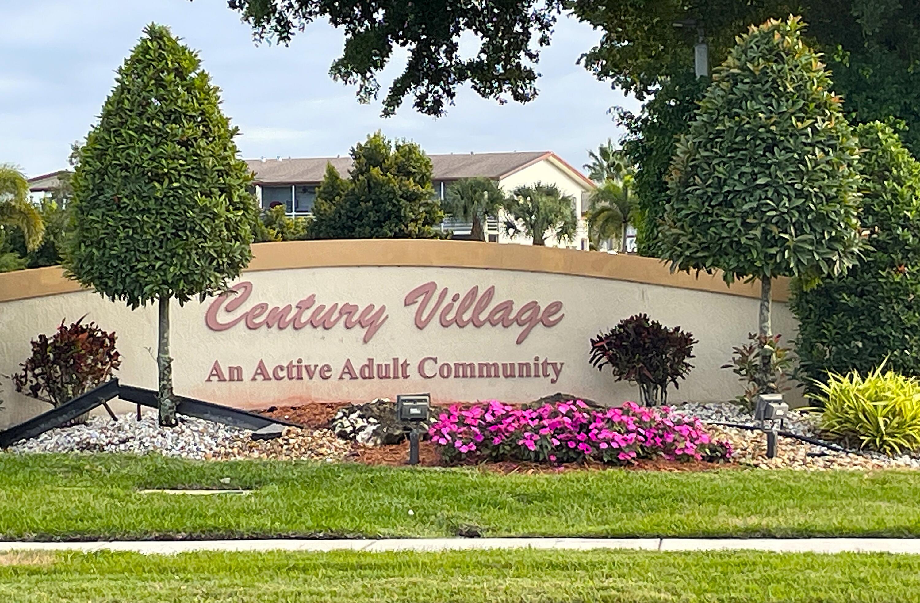 1020 Exeter, Unit 1020 Boca Raton, FL 33434 - Photo 28 of 29 a sign that is sitting in the grass
