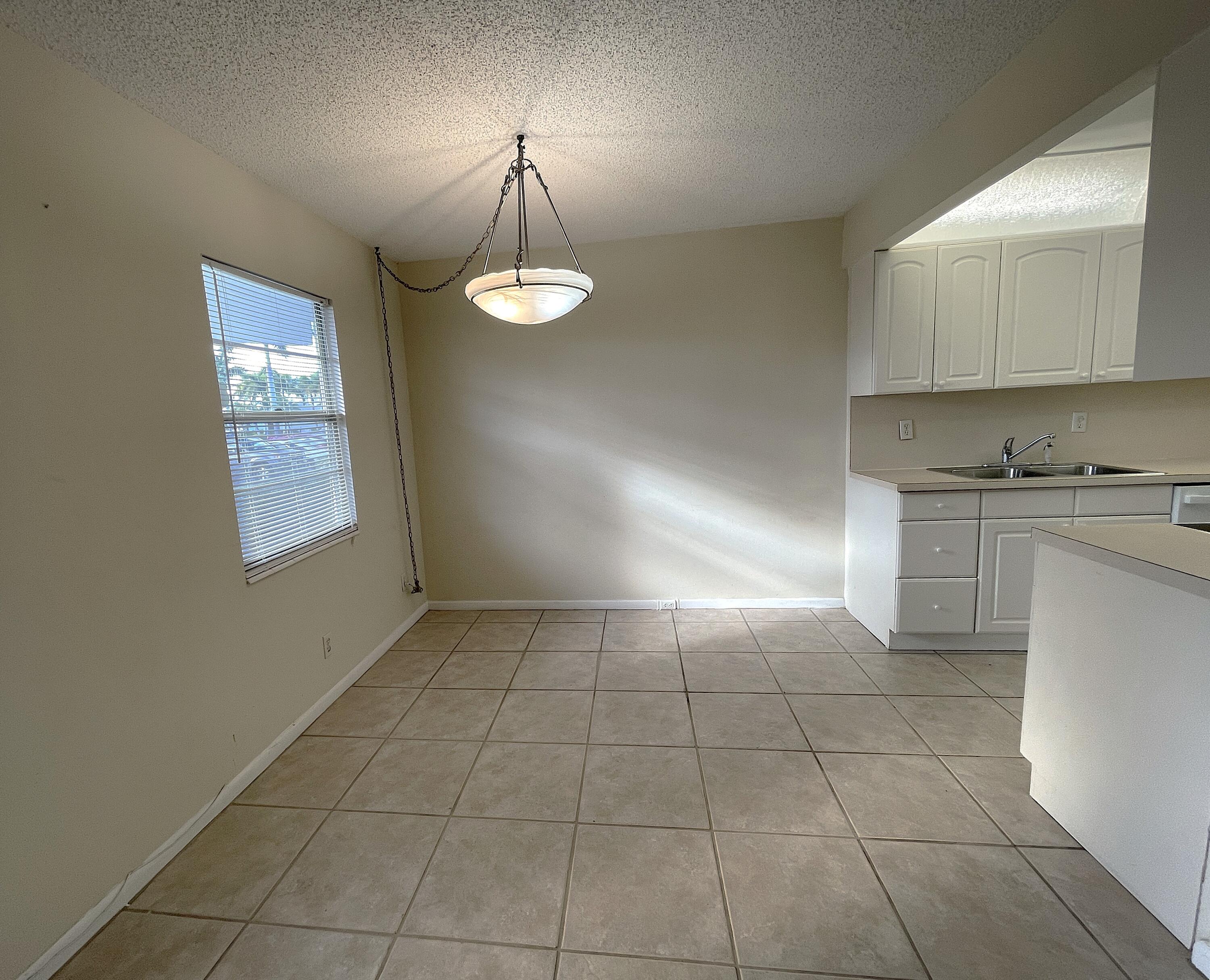 1020 Exeter, Unit 1020 Boca Raton, FL 33434 - Photo 5 of 29 a view of an empty room and window