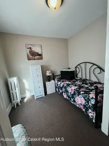 a bed room with furniture and a window