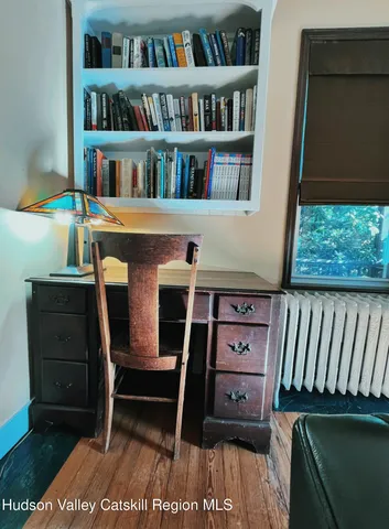 a view of a workspace with furniture