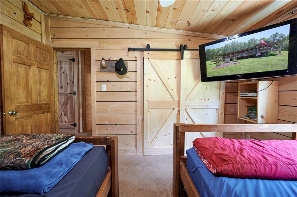 244 Tom Bic Road Rural Valley, PA 16249 - Photo 15 of 33 a bed room with a bed and a television