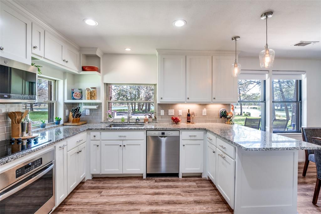 182 Huts Crossing Sadler, TX 76264 - Photo 11 of 40 a large white kitchen with lots of counter space a sink and appliances