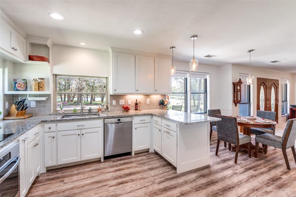 182 Huts Crossing Sadler, TX 76264 - Photo 12 of 40 a kitchen with white cabinets and sink