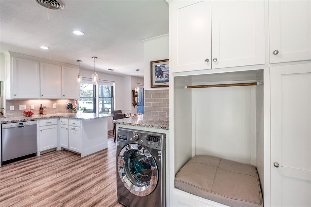 182 Huts Crossing Sadler, TX 76264 - Photo 14 of 40 a kitchen with a refrigerator and white cabinets
