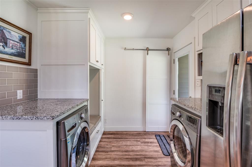 182 Huts Crossing Sadler, TX 76264 - Photo 16 of 40 a kitchen with a refrigerator a washer and dryer