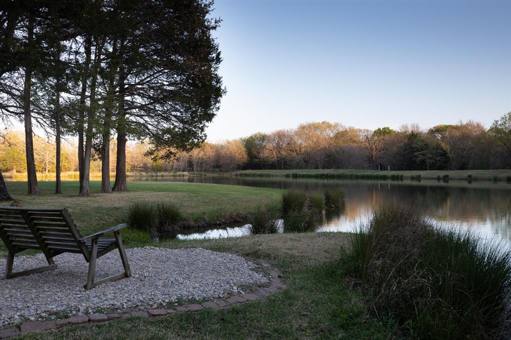 182 Huts Crossing Sadler, TX 76264 - Photo 2 of 40 a view of a lake with a bench and lake view
