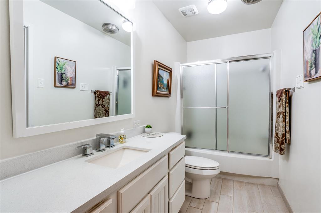 182 Huts Crossing Sadler, TX 76264 - Photo 21 of 40 a bathroom with a sink toilet and shower
