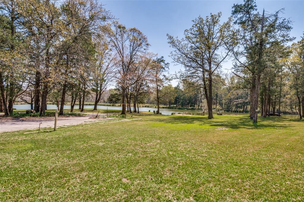 182 Huts Crossing Sadler, TX 76264 - Photo 24 of 40 a view of a swimming pool with trees