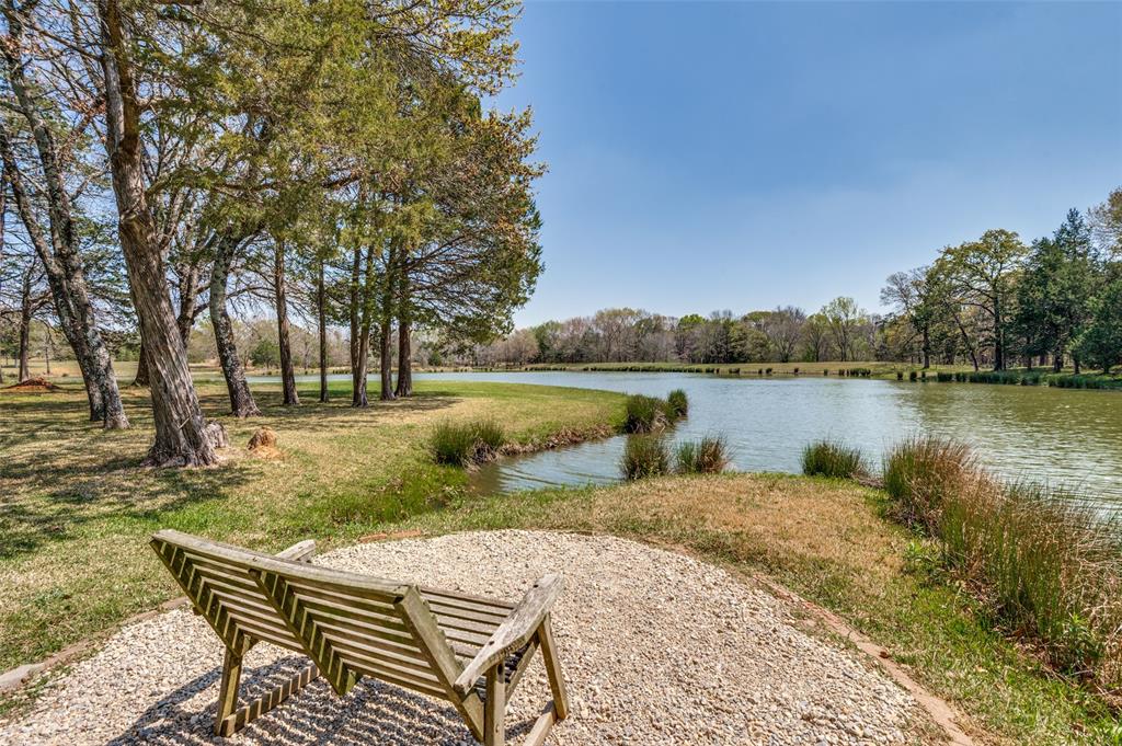 182 Huts Crossing Sadler, TX 76264 - Photo 25 of 40 a view of a lake with a yard and outdoor seating