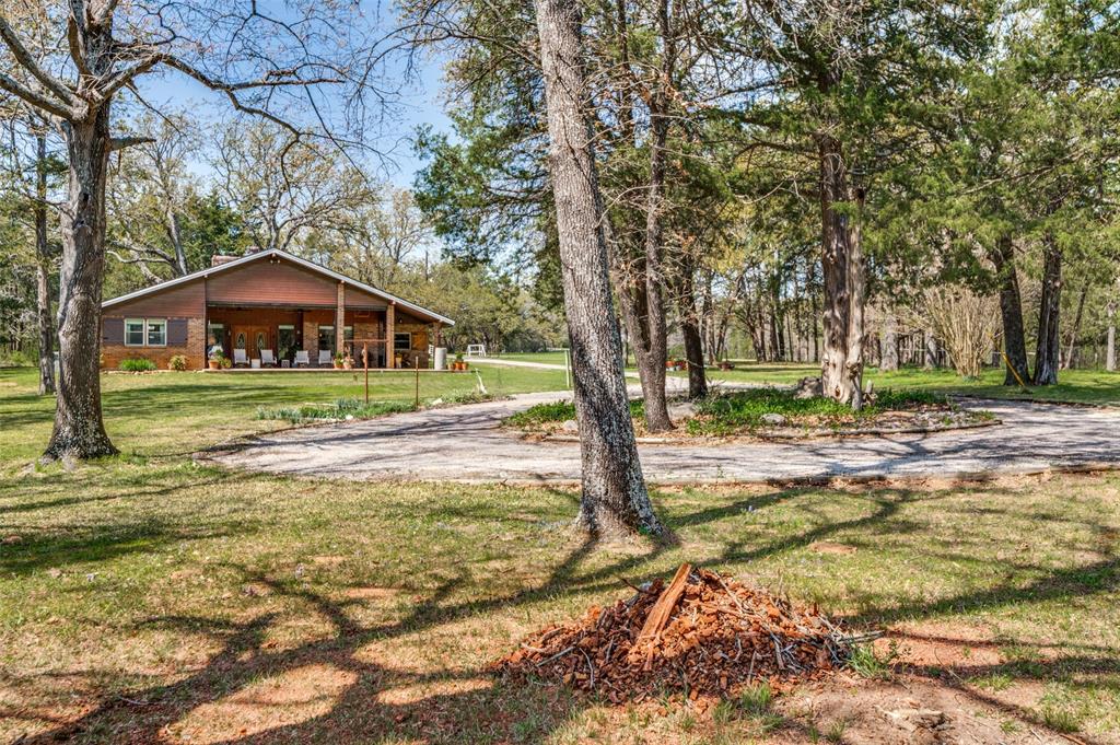 182 Huts Crossing Sadler, TX 76264 - Photo 28 of 40 a view of a large trees in front of a house