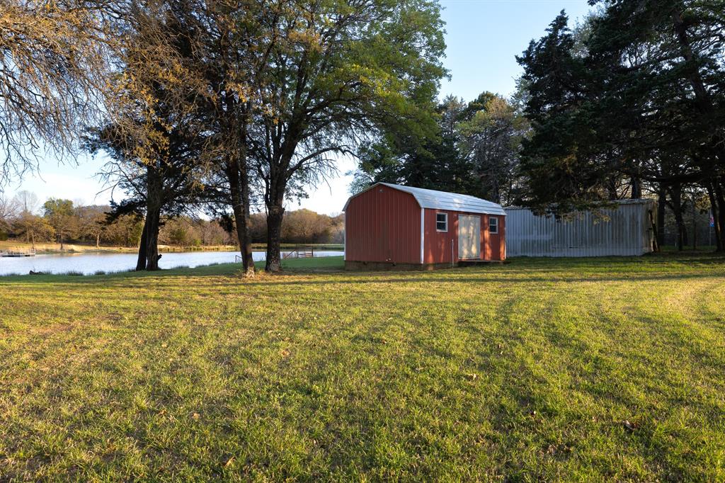 182 Huts Crossing Sadler, TX 76264 - Photo 32 of 40 a view of pool with tree in the background