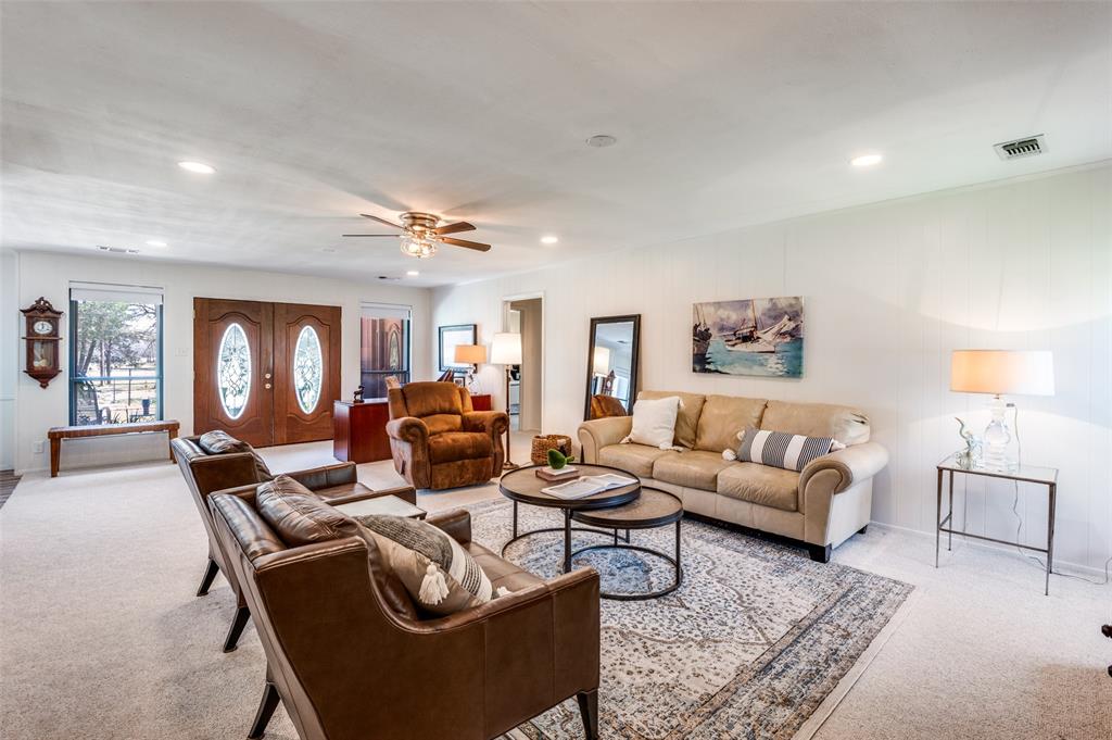 182 Huts Crossing Sadler, TX 76264 - Photo 6 of 40 a living room with furniture and wooden floor