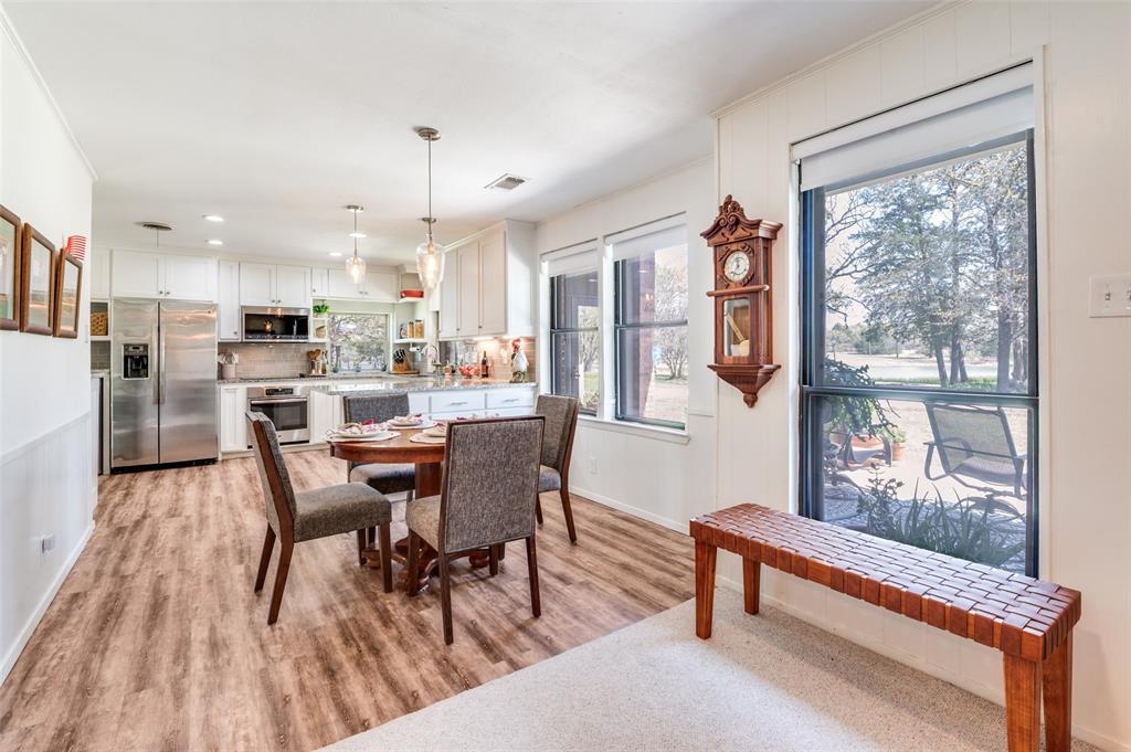 182 Huts Crossing Sadler, TX 76264 - Photo 8 of 40 a view of a dining room with furniture window and wooden floor