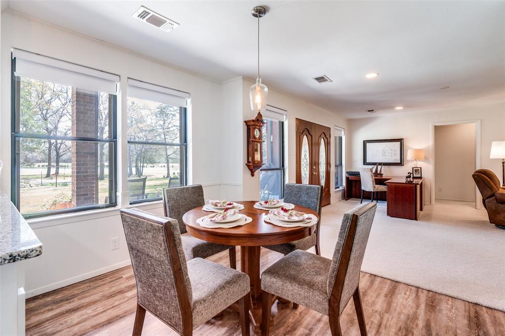 182 Huts Crossing Sadler, TX 76264 - Photo 9 of 40 a view of a dining room with furniture window and wooden floor