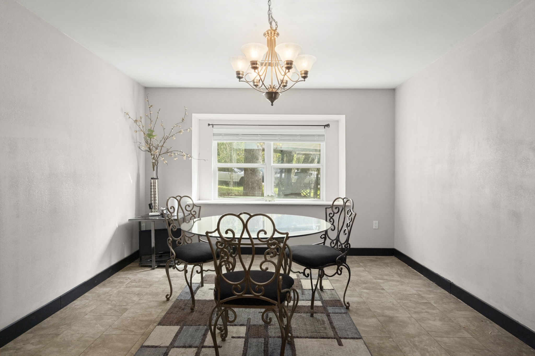 3414 Rustling Pines Street Spring, TX 77380 - Photo 6 of 26 a view of a dining room with furniture and a chandelier
