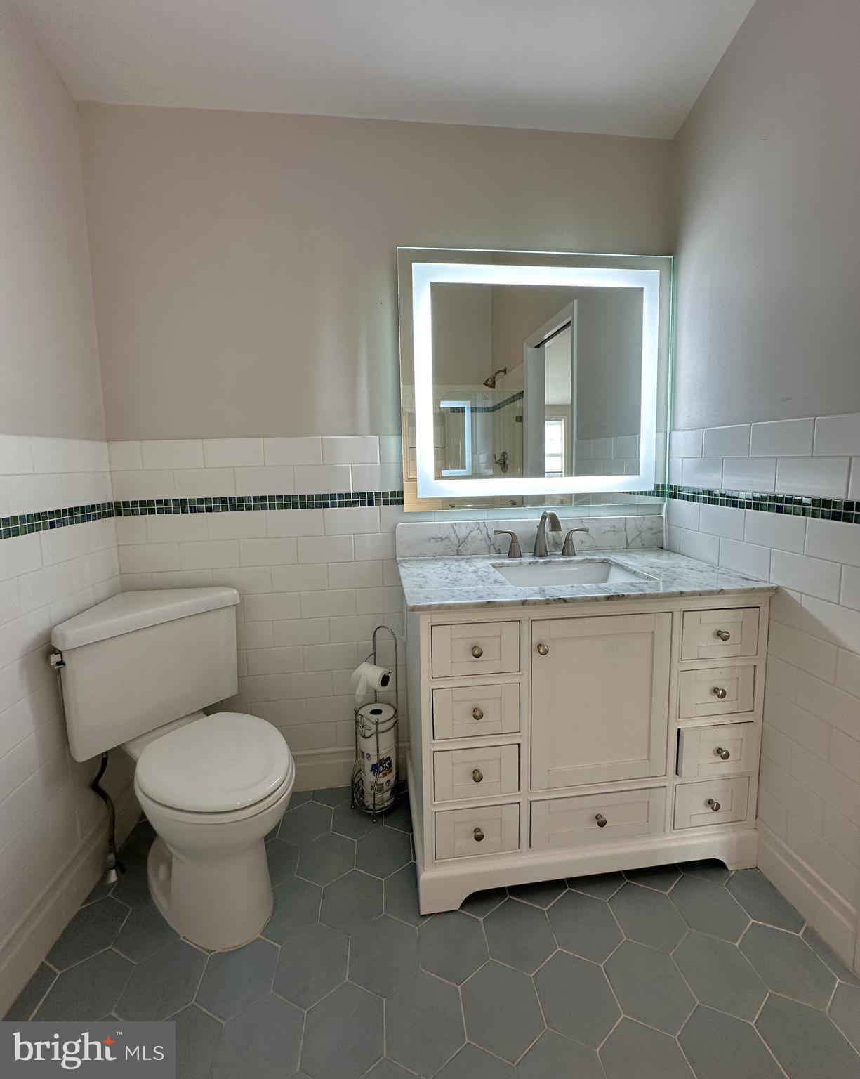 21 Big Road Schwenksville, PA 19473 - Photo 17 of 61 a bathroom with a granite countertop toilet sink and mirror