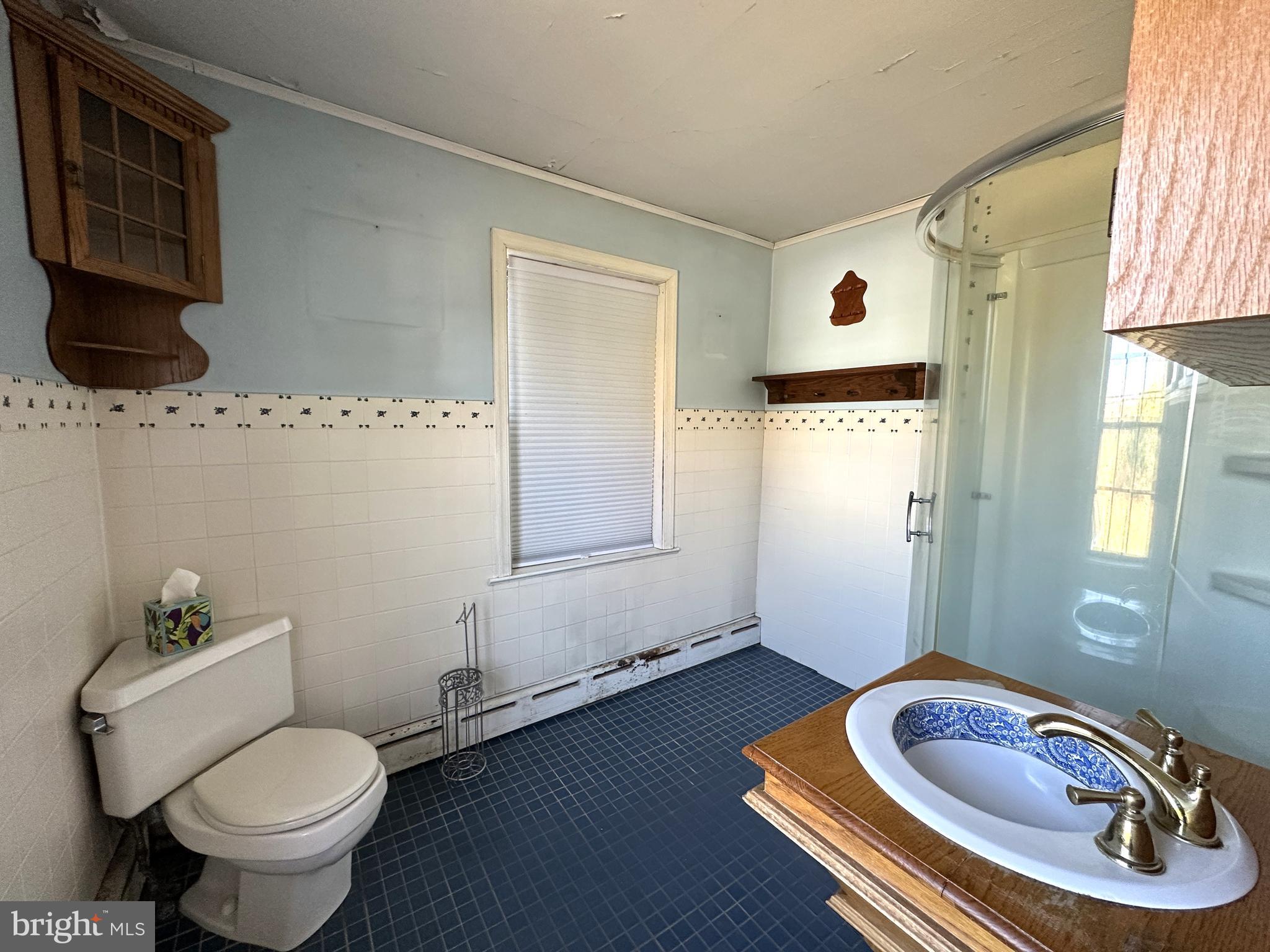 21 Big Road Schwenksville, PA 19473 - Photo 30 of 61 a bathroom with a toilet sink and mirror