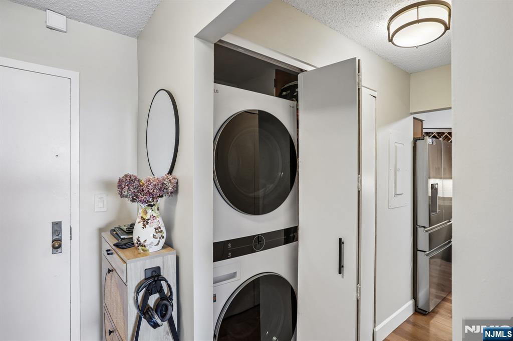 1077 River Road, Unit 303 Edgewater, NJ 07020 - Photo 13 of 27 a view of a storage and utility room with washer and dryer